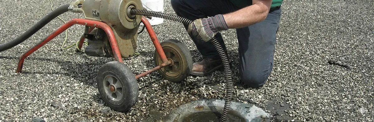 sewer rodding technician actively removing blockages from a sewer line in West Palm Beach, FL