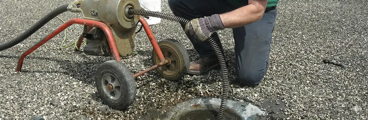 sewer rodding technician actively removing blockages from a sewer line in West Palm Beach, FL